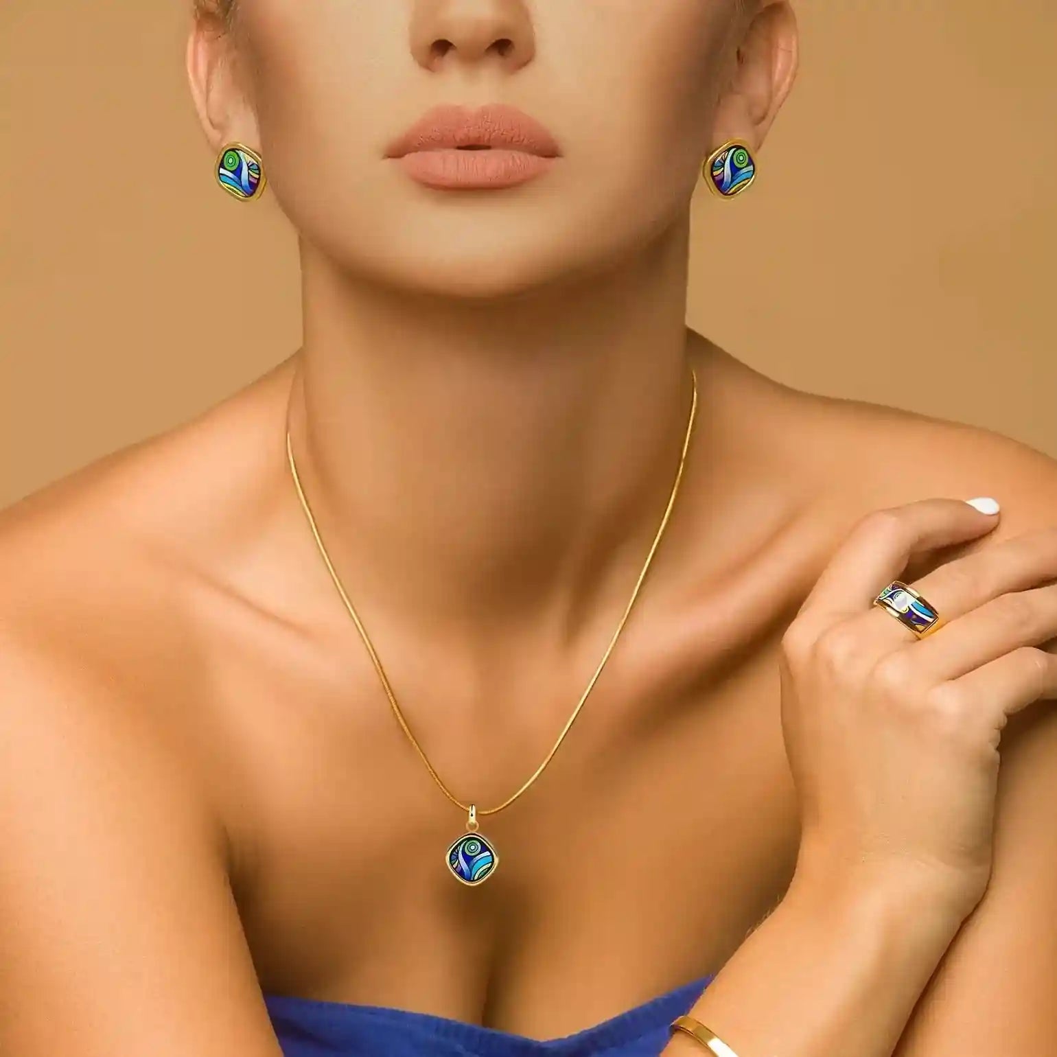 A girl wearing yellow gold earrings, a ring, a bracelet and a necklace from the Starry Night collection