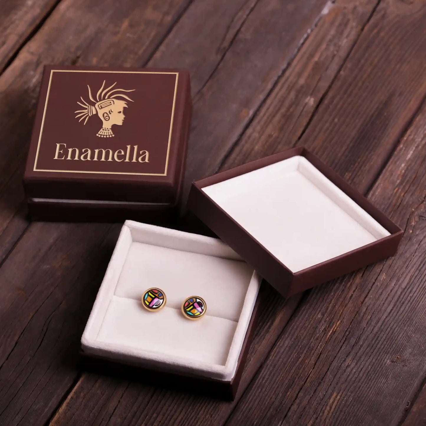 Yellow gold studs with the painting of Friedensreich Hundertwasser's "Spanish Nights". Earrings are placed inside a square box