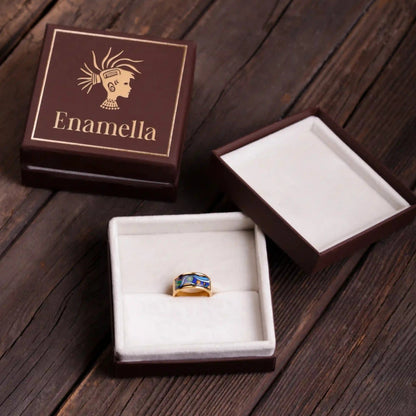 Yellow gold ring with the painting of Van Gogh's "Starry Night". The ring is placed inside a box
