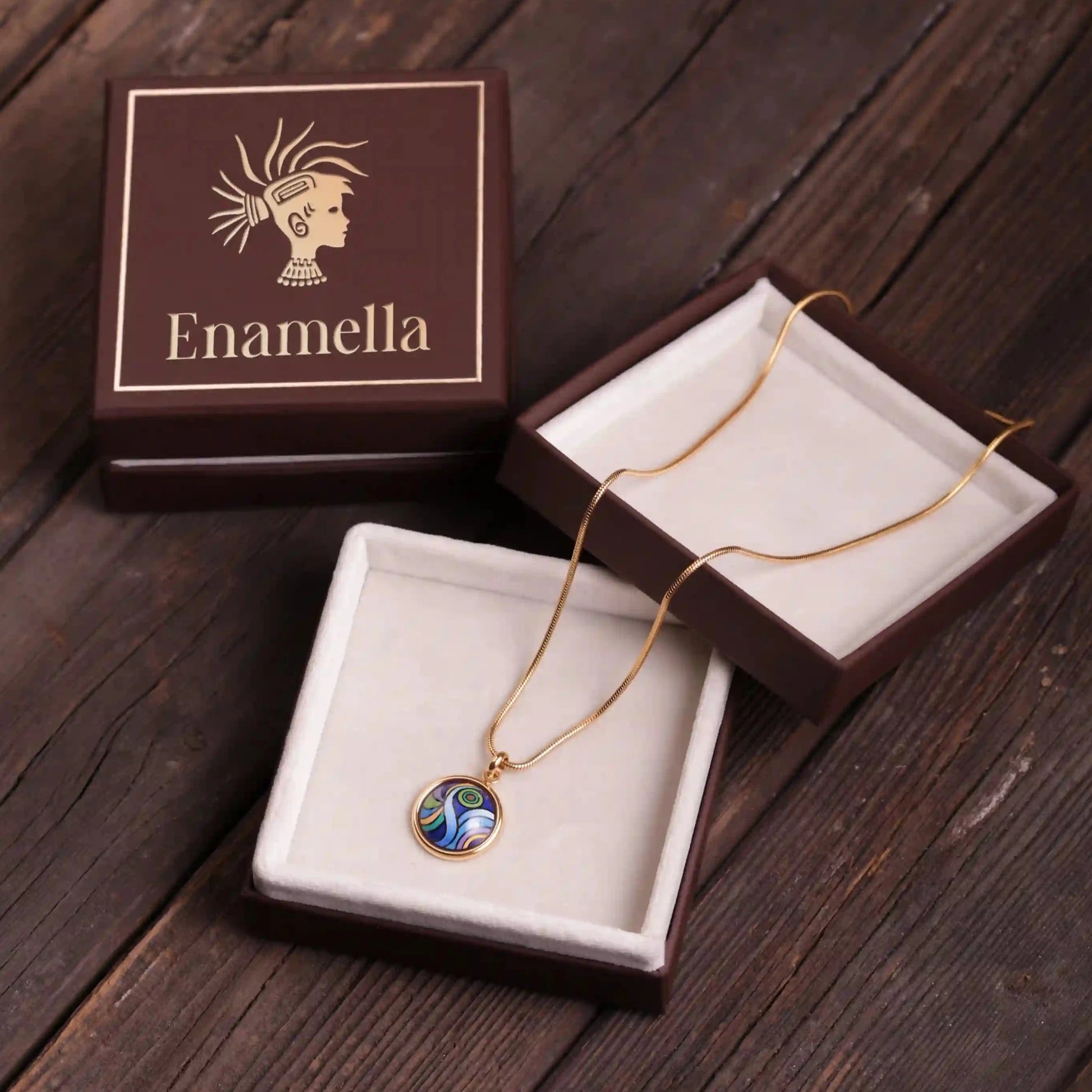 Yellow gold round necklace with the painting of Van Gogh's "Starry Night". The necklace is placed inside a box